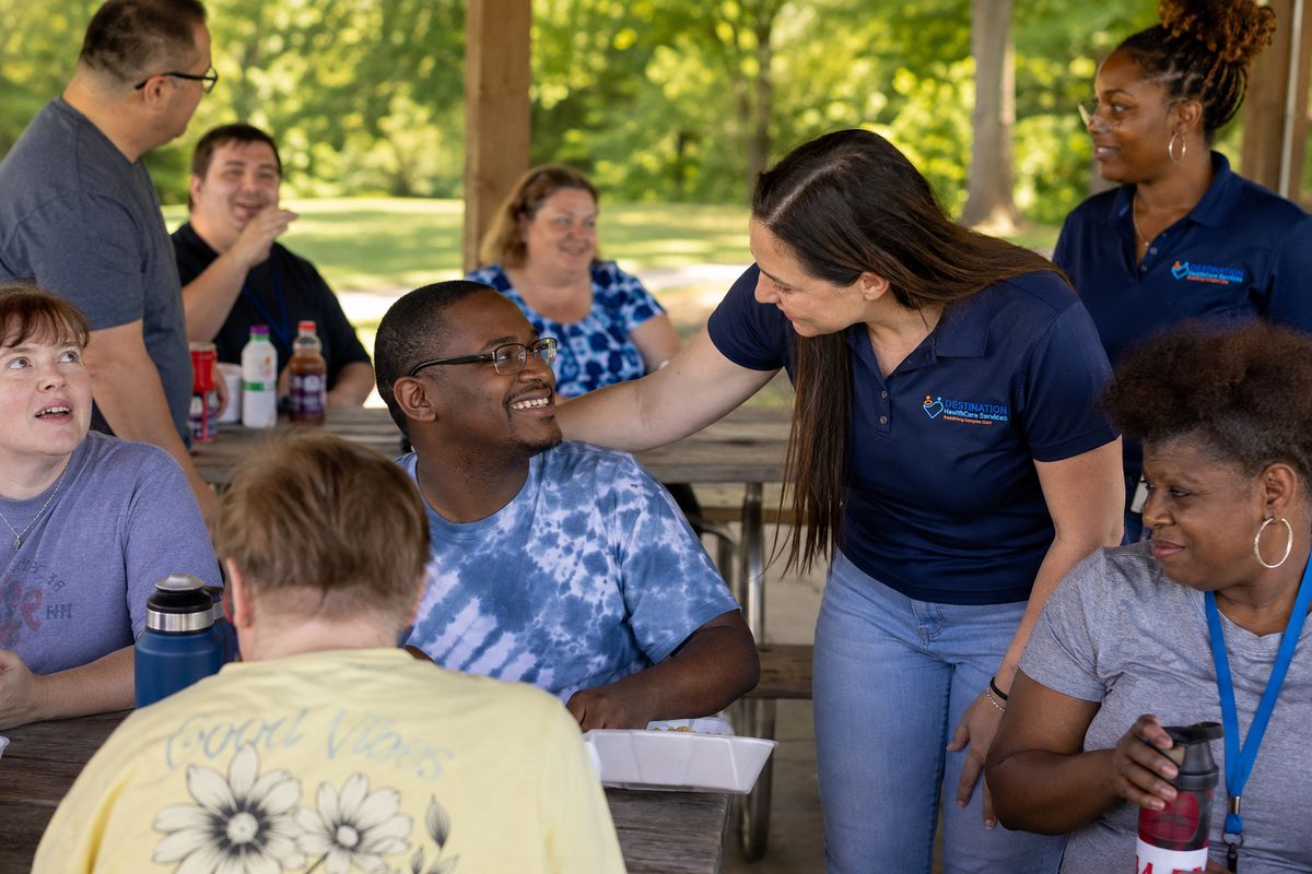 DHS community members gathered at a covered pavilion for a group activity in Tennessee